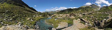 P013589: Panoramic photo of a watercourse in a primeval natural landscape